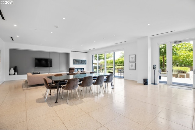 dining space featuring baseboards, visible vents, and recessed lighting