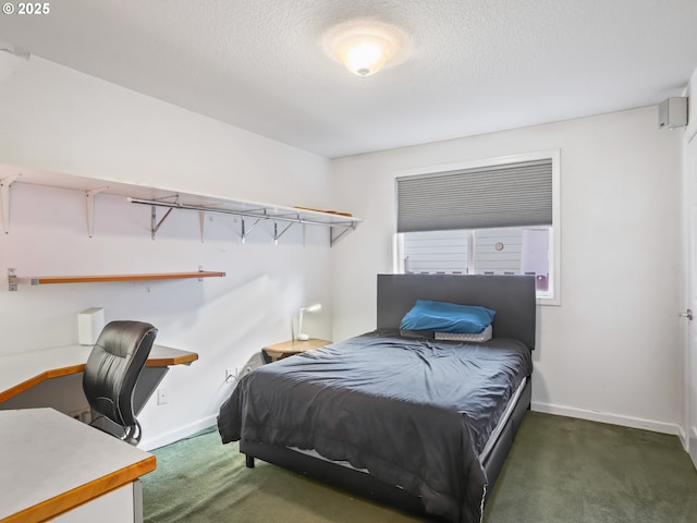 carpeted bedroom featuring a textured ceiling