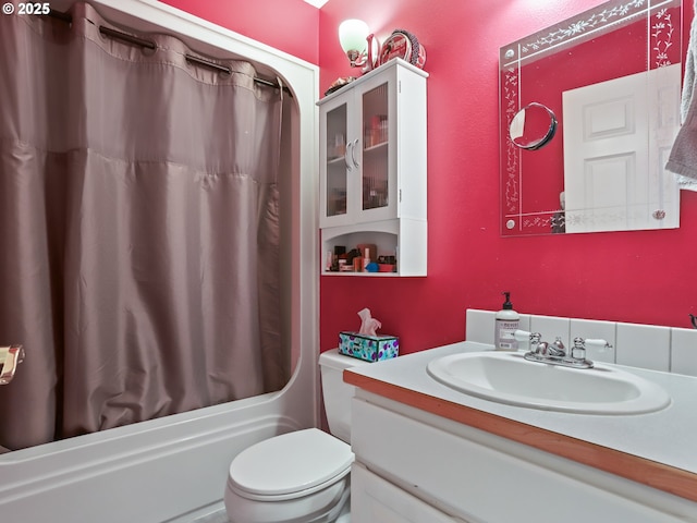 full bathroom with vanity, toilet, and shower / bath combo with shower curtain