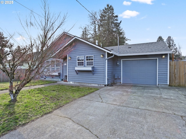 ranch-style house featuring a garage and a front yard