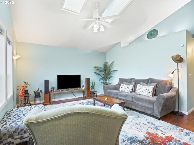 living room featuring dark wood-type flooring, ceiling fan, and vaulted ceiling