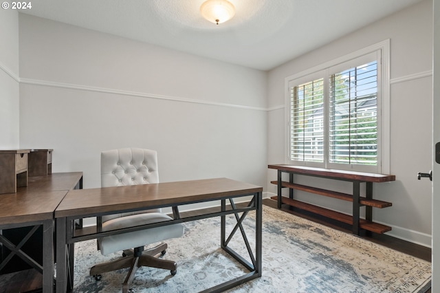 home office featuring hardwood / wood-style floors