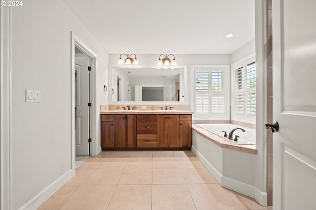 bathroom featuring a bathtub, tile patterned flooring, and vanity