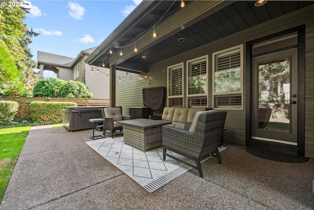 view of patio with a hot tub and an outdoor hangout area