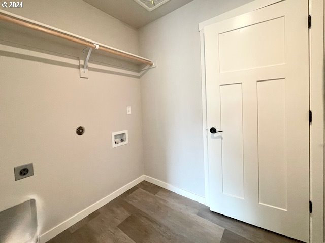 laundry room with hookup for a washing machine, dark hardwood / wood-style flooring, and electric dryer hookup