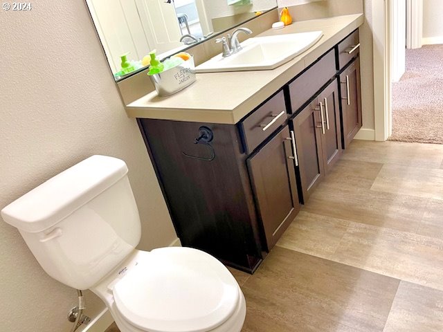 bathroom with vanity and toilet