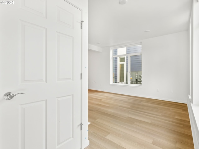 unfurnished room featuring light hardwood / wood-style flooring