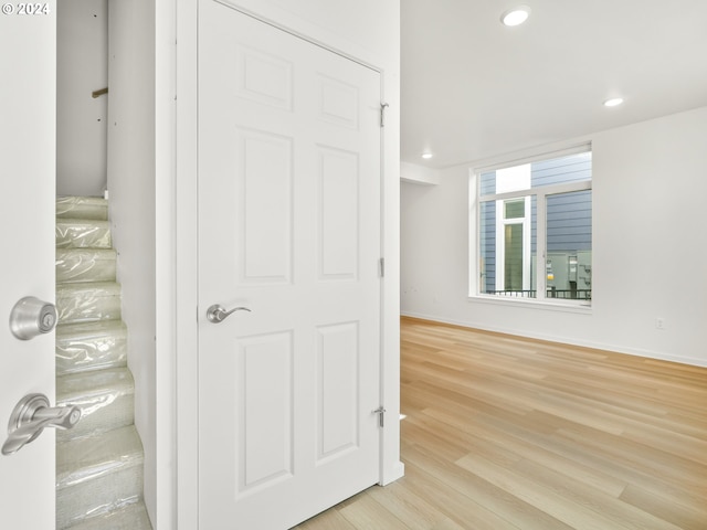 corridor featuring light hardwood / wood-style floors