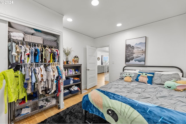 bedroom featuring a closet and light hardwood / wood-style floors