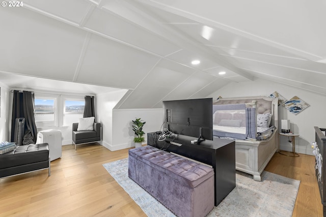 bedroom featuring lofted ceiling and light hardwood / wood-style flooring