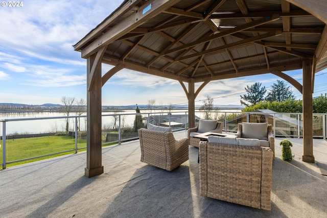 view of terrace featuring a gazebo, a water view, and outdoor lounge area