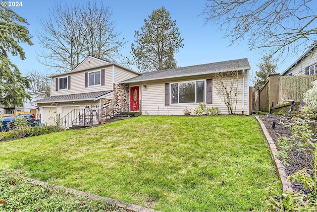 split level home featuring a front lawn and a garage