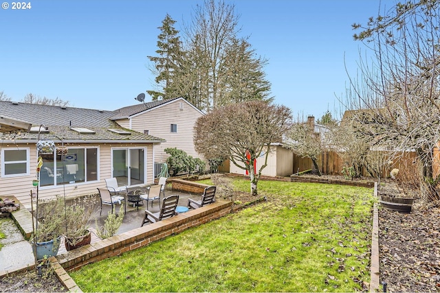 view of yard featuring a storage shed and a patio