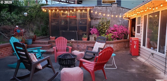 view of patio featuring an outdoor fire pit