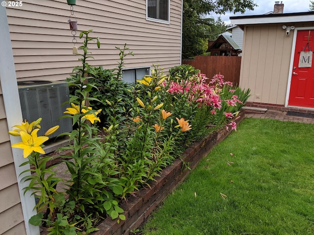 view of yard featuring central air condition unit