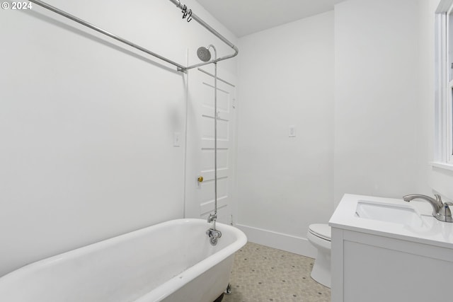 bathroom featuring toilet and vanity