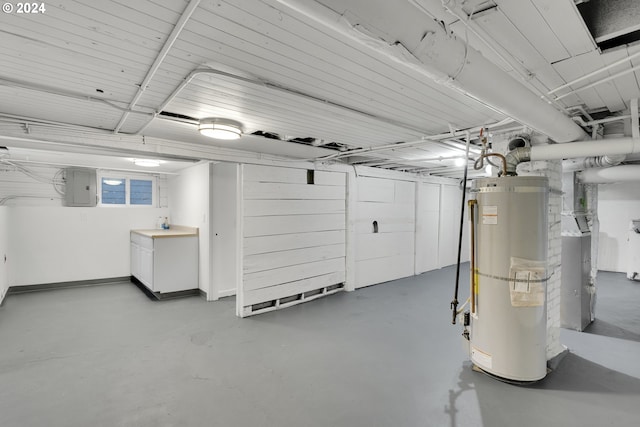 basement with electric panel and strapped water heater