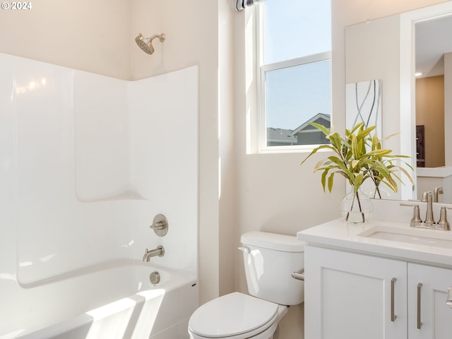 full bathroom featuring vanity, bathtub / shower combination, and toilet