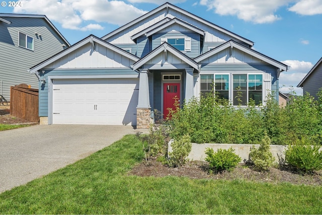 craftsman-style home featuring a front yard and a garage