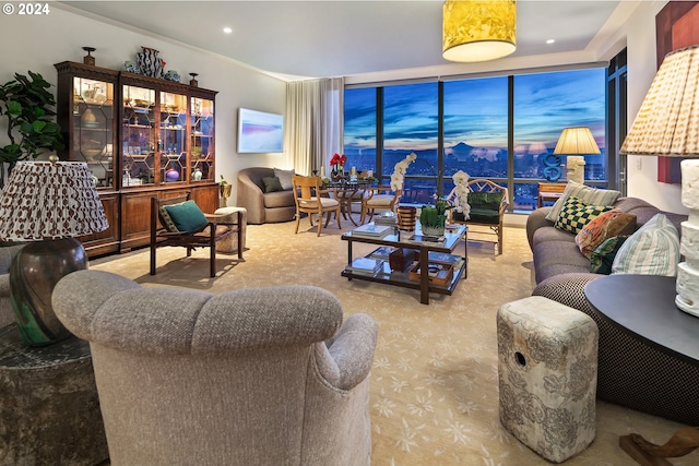 living area featuring a wall of windows and recessed lighting