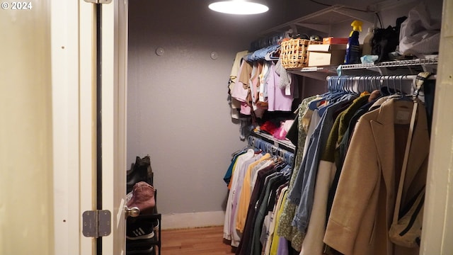 spacious closet featuring hardwood / wood-style flooring