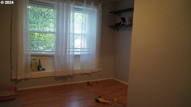 spare room featuring hardwood / wood-style flooring