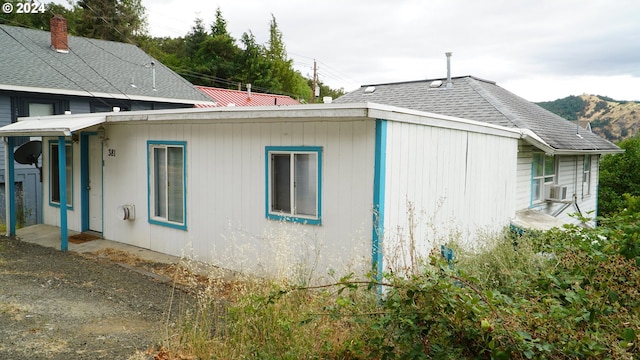 view of side of property featuring a mountain view