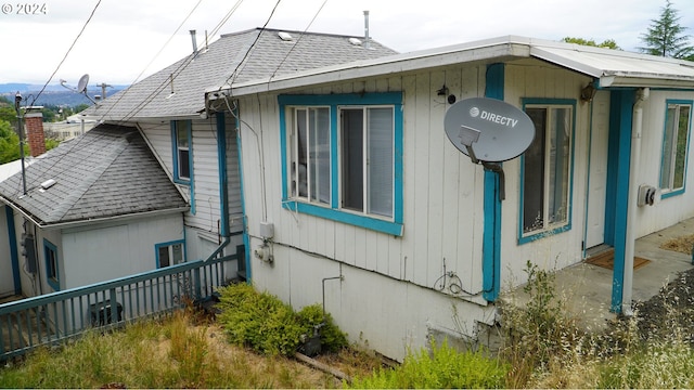 view of side of property featuring central AC unit