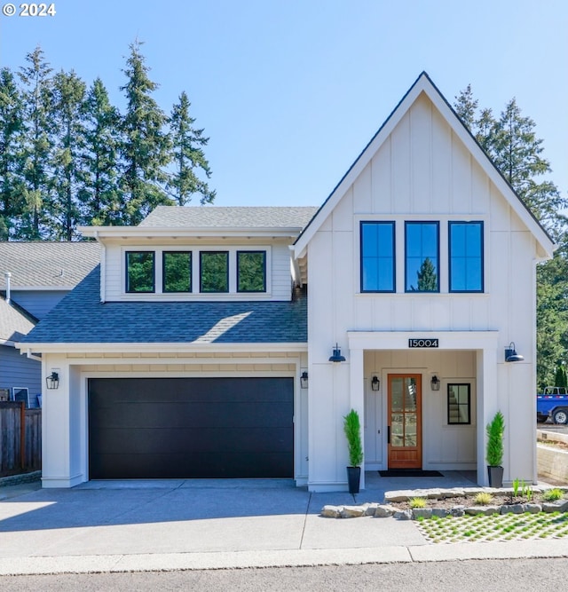 modern farmhouse featuring a garage