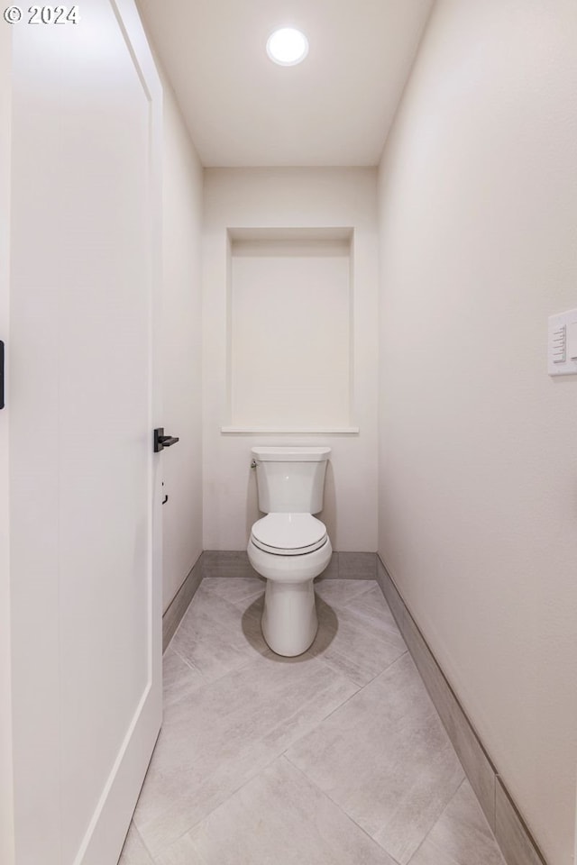 bathroom with tile patterned floors and toilet