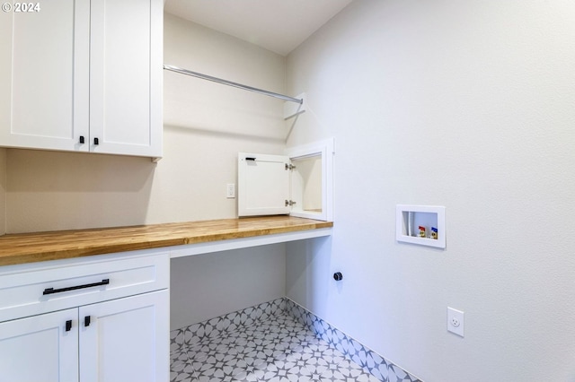 laundry room with cabinets and washer hookup