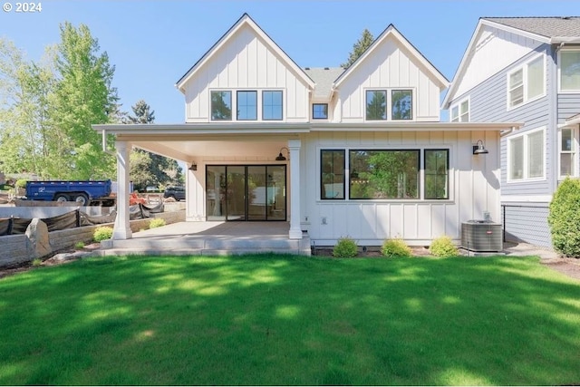 15004 SW 141st Ave, Portland, OR 97224 - back of house featuring board and batten siding, a patio area, and a lawn