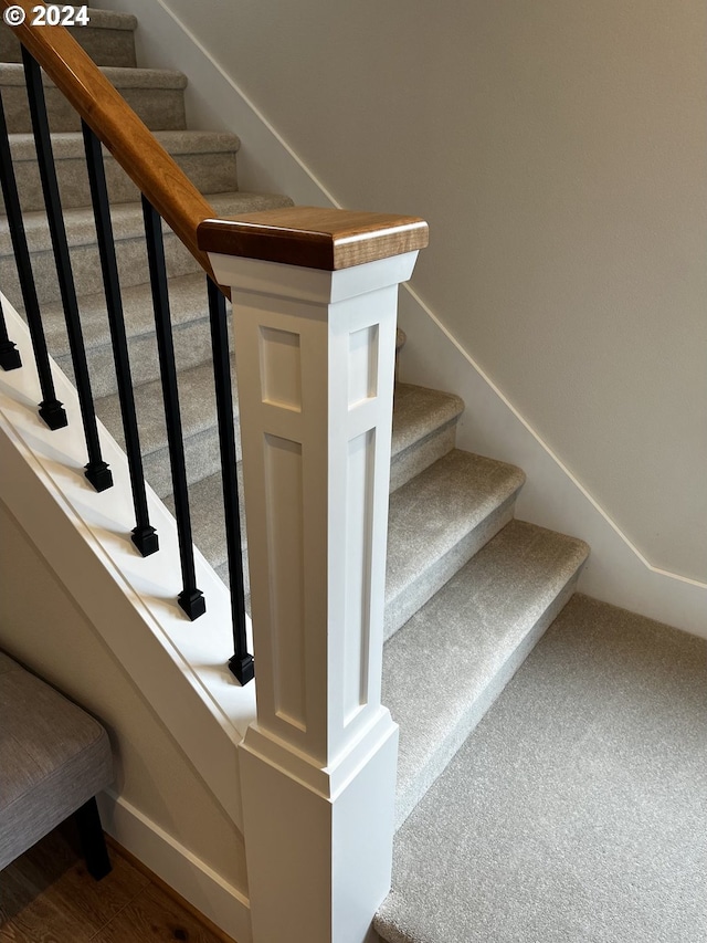 stairway with carpet floors