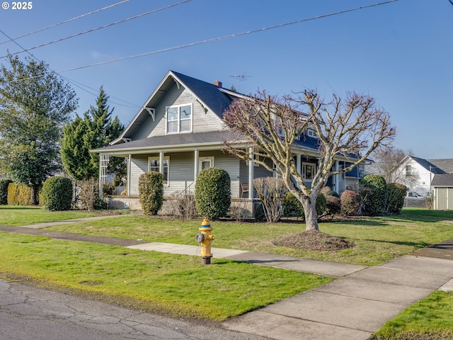 view of front facade with a porch and a front yard