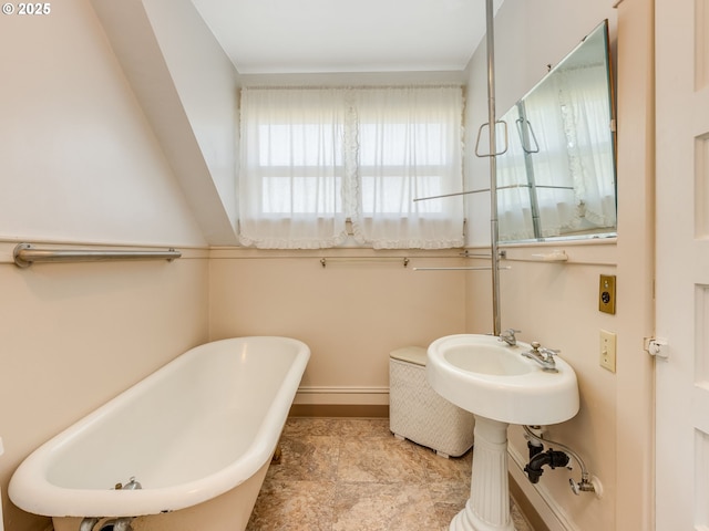 bathroom featuring sink and a bath