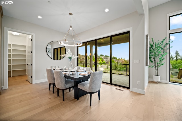 1669 NW Goodwin St, Camas, WA 98607 - dining room with light wood-style flooring, a chandelier, baseboards, and recessed lighting