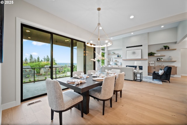 1669 NW Goodwin St, Camas, WA 98607 - dining room with a chandelier, light wood finished floors, recessed lighting, and baseboards