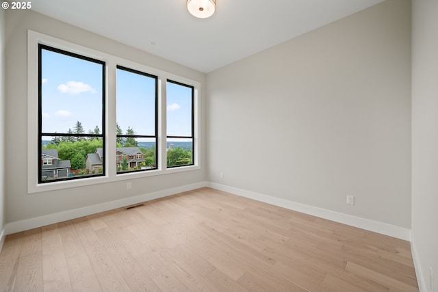 1669 NW Goodwin St, Camas, WA 98607 - empty room with light wood-style floors and baseboards