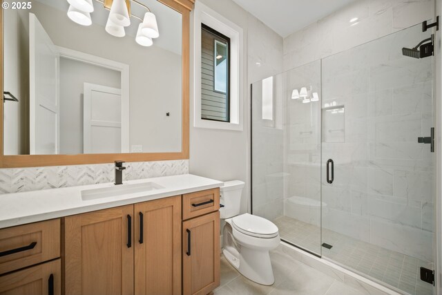 1669 NW Goodwin St, Camas, WA 98607 - bathroom featuring toilet, a shower stall, vanity, and tile patterned flooring
