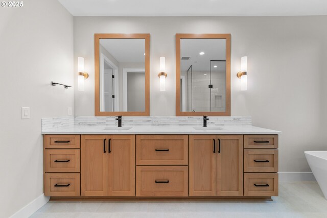 1669 NW Goodwin St, Camas, WA 98607 - full bathroom featuring a shower stall, baseboards, double vanity, a freestanding bath, and recessed lighting