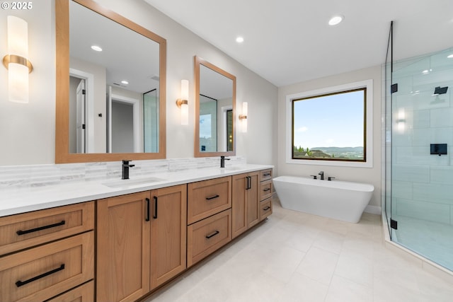 1669 NW Goodwin St, Camas, WA 98607 - bathroom with a stall shower, double vanity, a freestanding tub, and recessed lighting