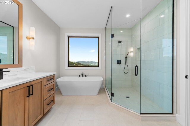 1669 NW Goodwin St, Camas, WA 98607 - bathroom featuring a shower stall, vanity, a freestanding bath, and tile patterned floors