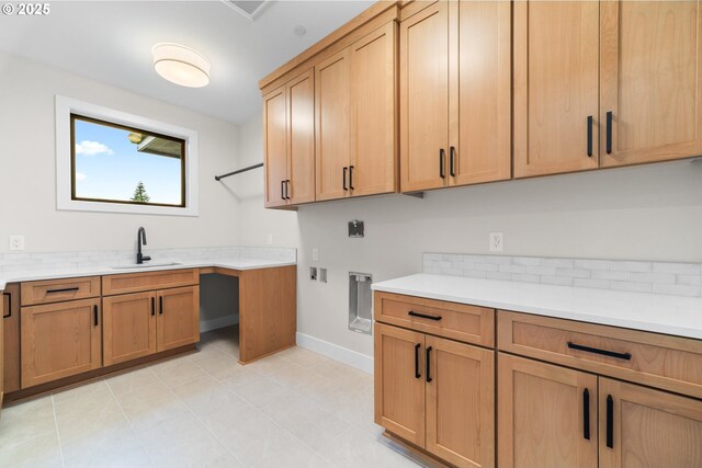 1669 NW Goodwin St, Camas, WA 98607 - laundry room with cabinet space, electric dryer hookup, baseboards, and light tile patterned floors