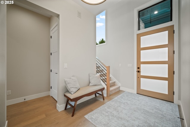 1669 NW Goodwin St, Camas, WA 98607 - entrance foyer featuring light wood finished floors, stairway, and baseboards