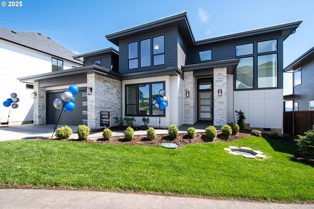 1669 NW Goodwin St, Camas, WA 98607 - view of front of house with driveway, a garage, and a front yard