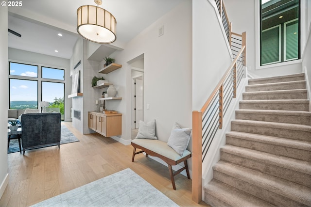 1669 NW Goodwin St, Camas, WA 98607 - staircase with wood finished floors, recessed lighting, and baseboards
