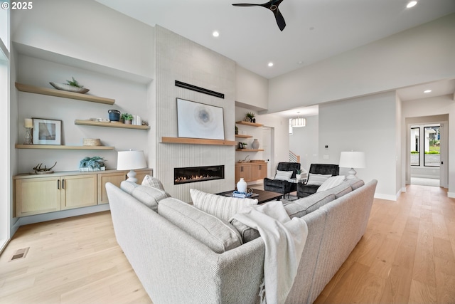 1669 NW Goodwin St, Camas, WA 98607 - living area with light wood-style floors, recessed lighting, a fireplace, ceiling fan, and baseboards