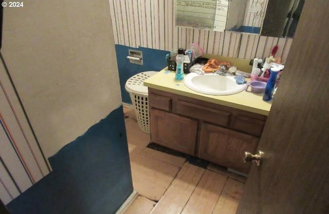 bathroom featuring vanity and hardwood / wood-style flooring