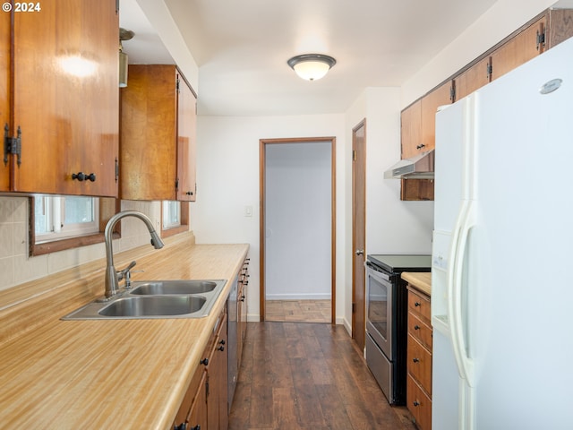 kitchen featuring decorative backsplash, stainless steel appliances, dark hardwood / wood-style floors, and sink