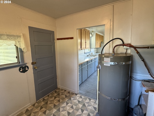 utilities with water heater and a sink